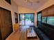 Relaxing sunroom with seating and access to patio at 9305 Haas Dr, Hudson, FL 34669