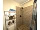 Clean bathroom with shower and tiled walls at 100 Bluff View Dr # 415A, Belleair Bluffs, FL 33770