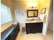 Clean bathroom with dark vanity and mirror at 100 Bluff View Dr # 415A, Belleair Bluffs, FL 33770