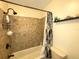 Clean bathroom with tile shower/tub combo at 100 Bluff View Dr # 415A, Belleair Bluffs, FL 33770