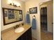 Bathroom with granite vanity, mirror, and shower/tub combo at 100 Bluff View Dr # 415A, Belleair Bluffs, FL 33770