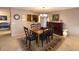 Charming dining area with wooden table and kitchen view at 100 Bluff View Dr # 415A, Belleair Bluffs, FL 33770