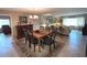 Bright dining room with wooden table and fireplace at 100 Bluff View Dr # 415A, Belleair Bluffs, FL 33770
