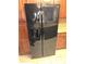 Black stainless steel refrigerator in a well-lit kitchen at 100 Bluff View Dr # 415A, Belleair Bluffs, FL 33770