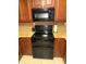 Well-equipped kitchen featuring granite countertops and modern appliances at 100 Bluff View Dr # 415A, Belleair Bluffs, FL 33770