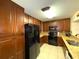 Well-equipped kitchen, granite counters, wood cabinets at 100 Bluff View Dr # 415A, Belleair Bluffs, FL 33770