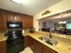 Kitchen with granite countertops and breakfast bar at 100 Bluff View Dr # 415A, Belleair Bluffs, FL 33770