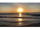 Stunning sunset over the ocean with a sailboat on the horizon at 100 Bluff View Dr # 415A, Belleair Bluffs, FL 33770