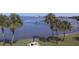 Picnic table and palm trees by waterfront at 100 Bluff View Dr # 415A, Belleair Bluffs, FL 33770