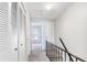 Upper level hallway with access to bedrooms and stairs at 11314 Grandville Dr # 11314, Temple Terrace, FL 33617