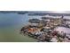Aerial view of a waterfront home with a large backyard at 16101 6Th E St, Redington Beach, FL 33708