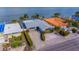 Waterfront home with gray roof and stone exterior at 16101 6Th E St, Redington Beach, FL 33708
