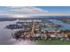 Wide aerial showcasing the home's waterfront location and expansive views of the surrounding neighborhood and waterways at 16101 6Th E St, Redington Beach, FL 33708