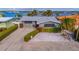Waterfront home with gray roof and stone exterior at 16101 6Th E St, Redington Beach, FL 33708
