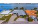 Waterfront home with gray roof and stone exterior at 16101 6Th E St, Redington Beach, FL 33708