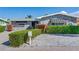 Stone house with lush landscaping and a brick driveway at 16101 6Th E St, Redington Beach, FL 33708