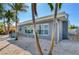 Gray house with large windows and waterfront view at 16101 6Th E St, Redington Beach, FL 33708