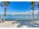Stunning view of the water from the backyard, featuring a fenced area and lush landscaping at 16101 6Th E St, Redington Beach, FL 33708