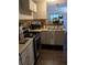 Functional kitchen featuring mosaic backsplash and stainless steel appliances at 2011 Auburn S St, St Petersburg, FL 33712