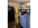 Efficient kitchen layout with a black refrigerator and mosaic backsplash at 2011 Auburn S St, St Petersburg, FL 33712