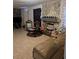 Spacious living room with a stone fireplace and comfortable seating at 2011 Auburn S St, St Petersburg, FL 33712