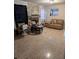Inviting living room featuring stone fireplace and neutral tile flooring at 2011 Auburn S St, St Petersburg, FL 33712