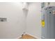 Small laundry room with water heater and space for washer and dryer at 2313 Palm Ave, Seffner, FL 33584