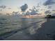 Scenic beach sunset view with calm waves and cloudy sky at 2716 49Th S St, Gulfport, FL 33707