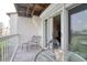 Outdoor balcony featuring patio seating and views of the surrounding landscape, perfect for relaxing and enjoying fresh air at 273 Madeira Cir, Tierra Verde, FL 33715