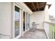 Charming balcony setting featuring outdoor furniture, providing an ideal space for relaxation and enjoying the view at 273 Madeira Cir, Tierra Verde, FL 33715
