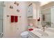 Bathroom with vanity, toilet, and shower with tiled wall at 273 Madeira Cir, Tierra Verde, FL 33715