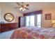 Comfortable bedroom featuring a ceiling fan, dresser, and balcony access with a view at 273 Madeira Cir, Tierra Verde, FL 33715