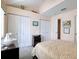 Bright bedroom features white closet doors and neutral-toned decor at 273 Madeira Cir, Tierra Verde, FL 33715