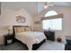 Cozy bedroom features a vaulted ceiling, fan, window, and comfortable bed at 273 Madeira Cir, Tierra Verde, FL 33715