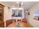 Bright dining area featuring a passthrough to the updated kitchen with stainless appliances at 273 Madeira Cir, Tierra Verde, FL 33715