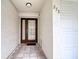 Close up of the front door and a peek inside the garage of this well maintained townhouse at 273 Madeira Cir, Tierra Verde, FL 33715