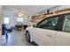 Spacious garage featuring epoxy flooring and ample storage and a ceiling fan at 273 Madeira Cir, Tierra Verde, FL 33715