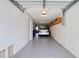 Spacious two car garage with epoxy flooring and plenty of room for storage at 273 Madeira Cir, Tierra Verde, FL 33715