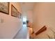 Well-lit hallway with carpet and wood trim, leading to various rooms at 273 Madeira Cir, Tierra Verde, FL 33715