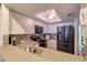 Bright kitchen with stainless steel appliances and white cabinets at 273 Madeira Cir, Tierra Verde, FL 33715