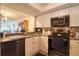 Renovated kitchen with stainless steel appliances and granite countertops at 273 Madeira Cir, Tierra Verde, FL 33715