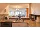 Open concept kitchen with stainless steel appliances and a view to living space at 273 Madeira Cir, Tierra Verde, FL 33715