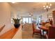 Open-concept living spaces showcase a smooth transition between dining room and living room with natural lighting at 273 Madeira Cir, Tierra Verde, FL 33715