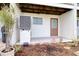 Outdoor patio with white tile, a doorway, and a grill, with outdoor plants at 273 Madeira Cir, Tierra Verde, FL 33715