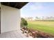Outdoor patio area with a view of a green area, trees, and a walkway at 273 Madeira Cir, Tierra Verde, FL 33715