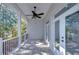 Covered back porch with ceiling fan and French doors at 3125 Downing St, Clearwater, FL 33759