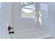 Clean bathroom with white subway tile and a bathtub at 3125 Downing St, Clearwater, FL 33759