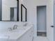 Modern bathroom with double vanity and elegant mirrors at 3125 Downing St, Clearwater, FL 33759
