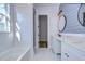Elegant bathroom with double vanity, marble counters, and a spacious soaking tub at 3125 Downing St, Clearwater, FL 33759