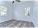 Spacious bedroom featuring wood-look floors and ceiling fan at 3125 Downing St, Clearwater, FL 33759